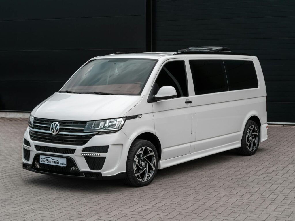 A modern Volkswagen van parked outdoors, showcasing urban style and design.