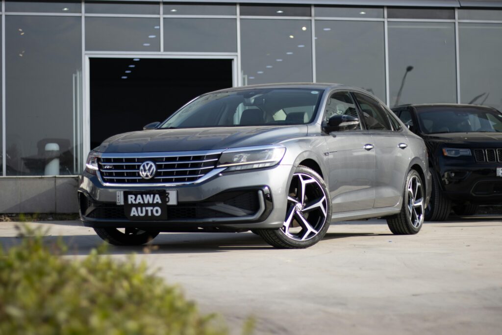 A sleek gray Volkswagen sedan displayed at a car showroom in Erbil, Iraq.